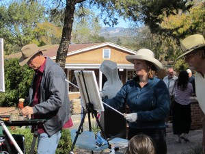 Artists paint and attendees peruse the galleries along Canyon Road at last year’s event.